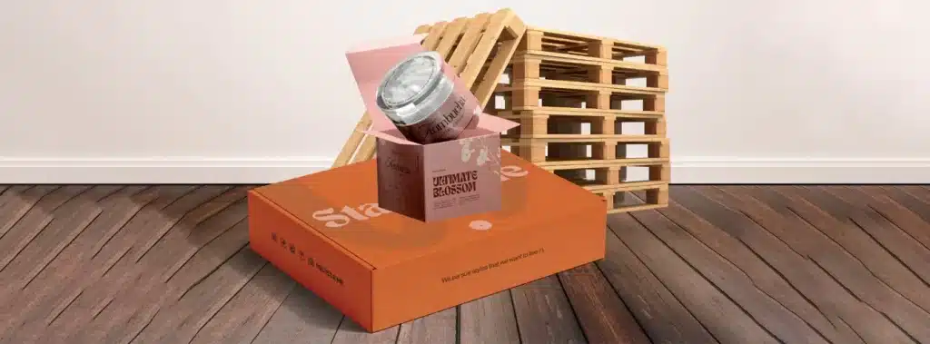 A box with a can of beer placed on top showcasing primary packaging in a simple and clear arrangement